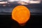 Closeup of moonlight lantern in hand at sunset on the blurry beach background