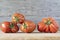 Closeup of Mortgage Lifter tomatoes on the wooden background.