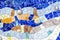 Closeup of mosaic of colored ceramic tile by Antoni Gaudi at his