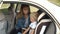 Closeup of a mother fastens her little son`s seat belts in a car seat in the car
