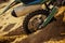 Closeup of motocycle wheel trapped in sand