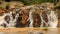 closeup mountain streams falling among stones in park