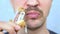 Closeup mouth. mustached man eats deep fried chicken wings