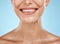 Closeup, mouth and woman with skincare, cosmetics and dermatology with girl on blue studio background. Face, female and