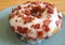 Closeup of Mouthwatering Maple-glazed Bacon Doughnut on a Plate