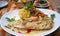 Closeup Mouthwatering Pan-seared Lake Trout with Creamy Shrimp Sauce