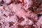 Closeup mouthwatering texture of strawberry chocolate chunk ice cream