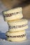 Closeup of multiple coconut alfajore cookies stacked on each other