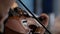 Closeup of musician playing the violin