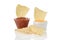 Closeup nacho corn chips dipped in cheese and salsa