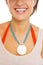 Closeup on necklace on neck of beach woman