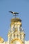 Closeup of nesting European storks on white cathedral tower with beautiful sunlight in village of Southern Spain off highway A49