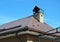 Closeup on new house rain gutter system and roof protection from snow board on house roofing