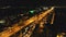 Closeup night traffic highway with driving cars, trucks aerial. Philippines Manila town cityscape