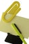 Closeup of notepad, paperclip and pen on stand in yellow and black isolated.