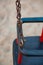 Closeup od a small swing with metal chains