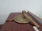 Closeup of an old gong and mallet on a wooden table