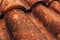 Closeup of old rustic terracotta roof tiles pattern as background
