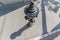 closeup of old weathered fire hydrant on street. black fire hydrant with shadow. Top view. help for fire brigade