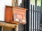 Closeup of an old weathered rusty Japanese metallic mailbox