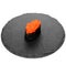 Closeup of one piece of sushi on a black round board isolated on white