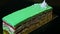 Closeup one portion of green glazed layered cake with white bizet rotates around