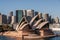 Closeup of Opera House with skyscrapers, Sydney, Australia