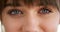 Closeup for optic vision exam of a young woman looking for lenses or glasses to improve eyesight. Face portrait of a