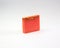 Closeup of an orange-scented soap bar isolated on a white background