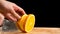 Closeup of orange slice on cutting board