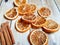 Closeup Orange Slices and Cinnamon on Wood