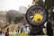 Closeup of orange snow maker machine with fan blades near ski resort slope in autumn, fall