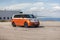 Closeup of an orange Volkswagen ID. Buzz parked in Malmo Pier, Skane County, Sweden