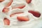 Closeup of organic sliced strawberries in whipped cream