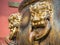 Closeup of ornate bronze handle on water urn