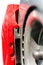 Closeup pads on disc car brake in red caliper