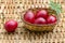 Closeup paint Easter red eggs in the basket on wicker table