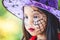 Closeup on painted face of asian child girl on Halloween celebration