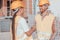 Closeup of a pair of builders shaking hands while standing near the construction site