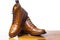 Closeup of Pair of High Men`s Tanned Brogues Boots