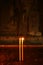 Closeup a Pair of Lit Candles in the Votive Candle Stand Inside an Old Church