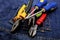 Closeup pair of pliers screwdriver work tool electrician dark background