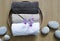 Closeup of pampering towels and zen stones for female bodycare