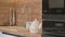 Closeup panorama of modern white and wooden beige kitchen interior