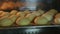 Closeup panorama on small fresh cookies baking in oven at kitchen