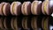 Closeup panorama violet french macarons stand on edge in row