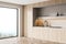 Closeup of panoramic kitchen with light grey stone niche of the cabinet