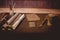 Closeup of parchment rolls with ancient tools on the table under the lights