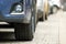 Closeup of parked car on a city street side with new winter rubber tires