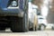 Closeup of parked car on a city street side with new winter rubber tires